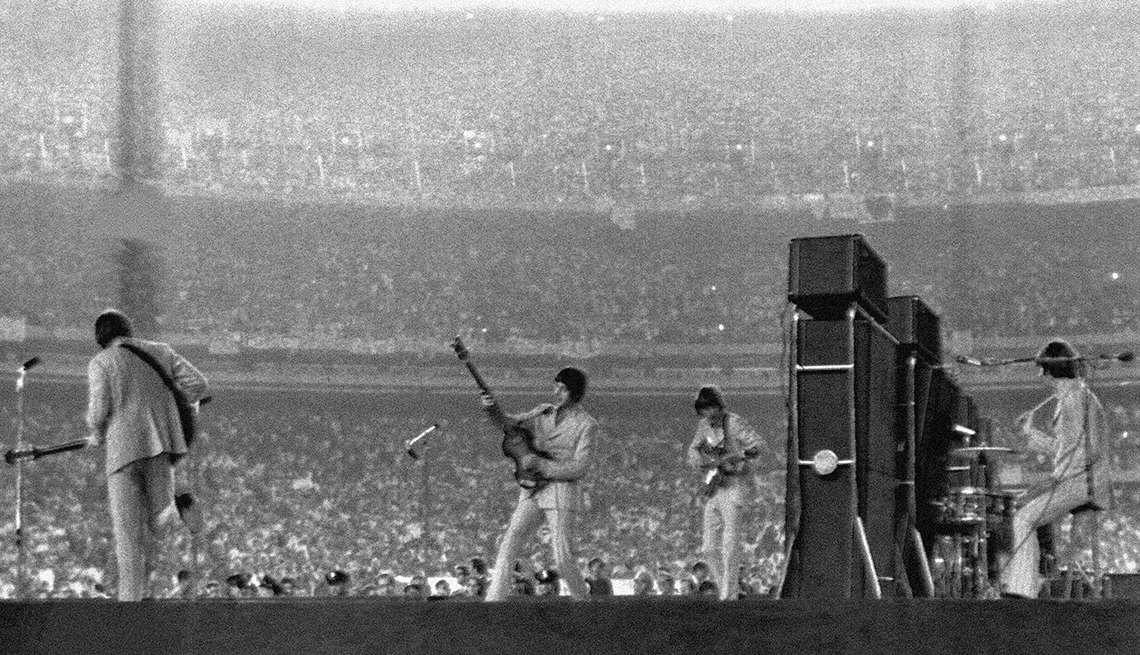 The Beatles perform at Shea Stadium