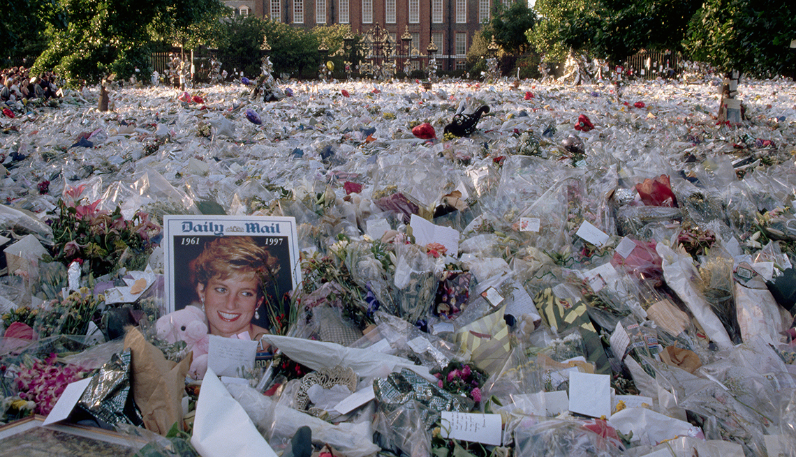 item 1 of Gallery image - A field full of wrapped flowers honors Princess Diana