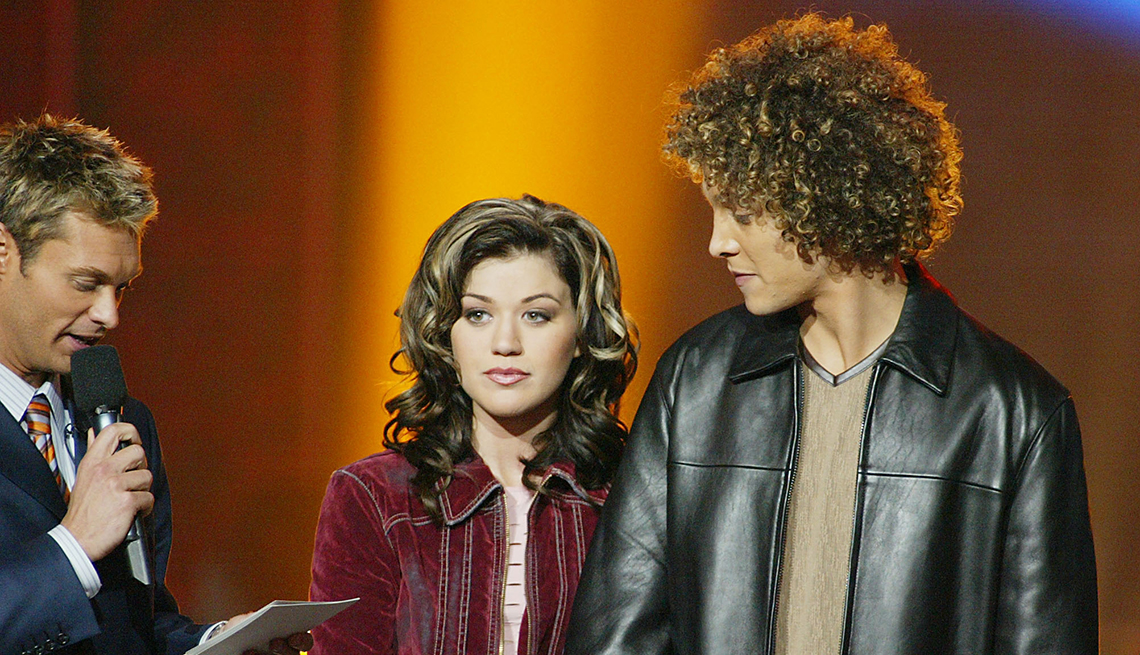 item 27 of Gallery image - Hosts Ryan Seacrest and Brian Dunkleman with Kelly Clarkson and Justin Guarini before the announcement of the winner of American Idol at the Kodak Theatre in Hollywood, Ca., Sept. 4, 2002.