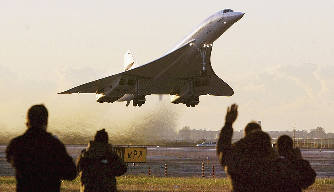 item 8 of Gallery image - people wave to concorde plane that is taking off