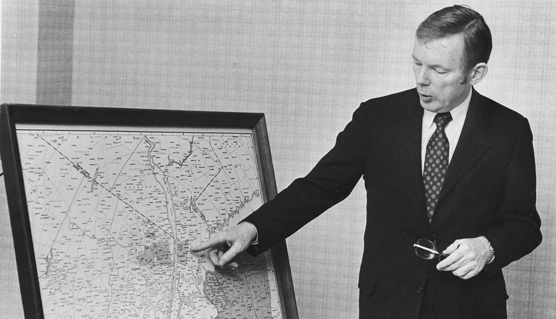 item 23 of Gallery image - black and white image of charles dolan, president of cablevision, pointing to map of new york area