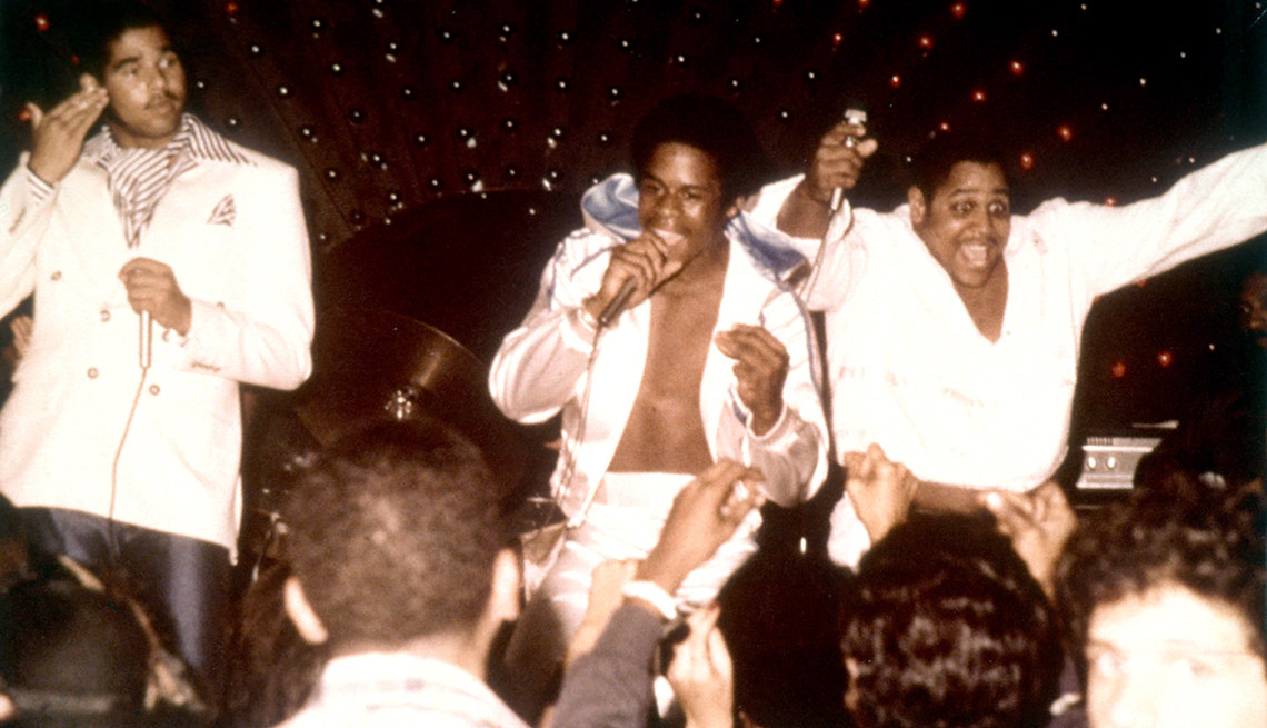 item 21 of Gallery image - sugarhill gang, including wonder mike, master g and big bank hank on stage singing and dancing in front of crowd