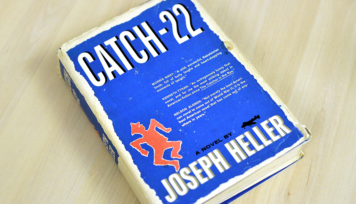 item 20 of Gallery image - book with blue cover that has catch 22 and joseph heller in big white letters; on wooden background