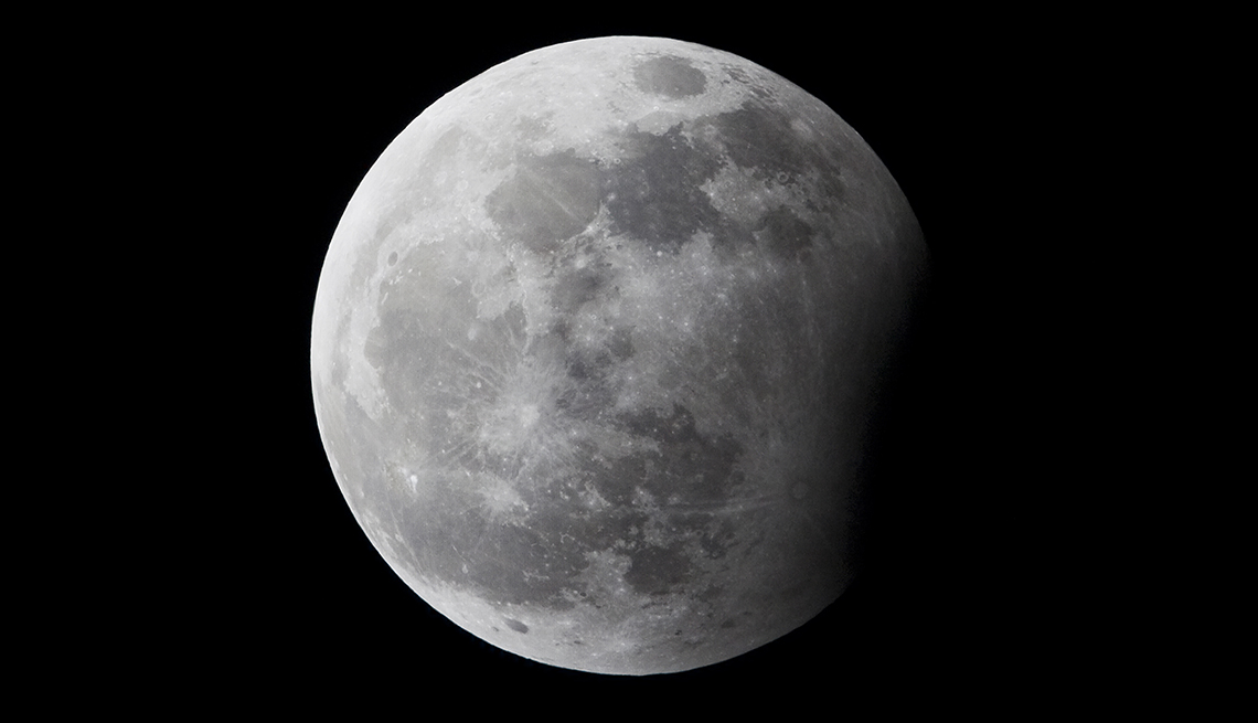item 18 of Gallery image - Moon with partial lunar eclipse against black background