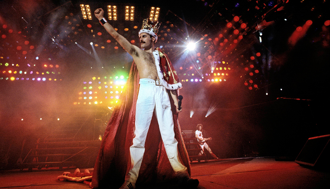 item 7 of Gallery image - freddie mercury on stage with right arm raised