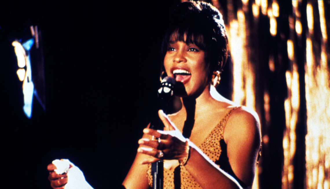 item 6 of Gallery image - whitney houston singing into standing microphone