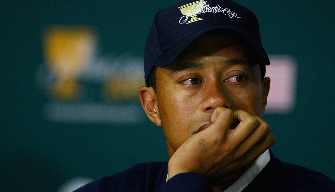 item 4 of Gallery image - tiger woods looking to the side with hand covering mouth