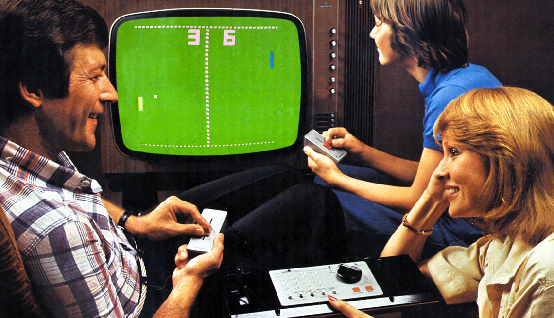 item 2 of Gallery image - three people in front of television, playing the pong video game