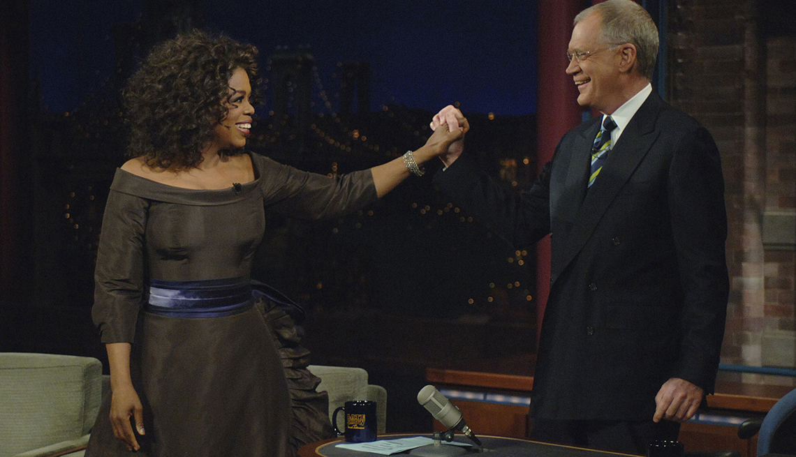 item 4 of Gallery image - oprah winfrey holding hand of david letterman on set of the late show with david letterman