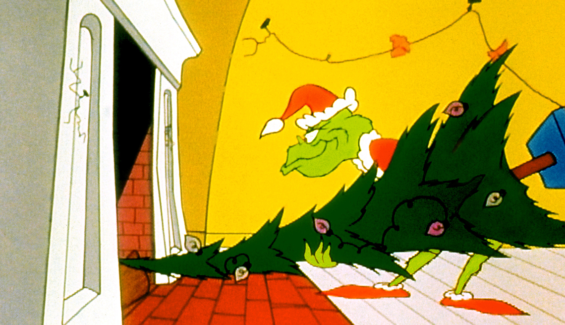 item 14 of Gallery image - the grinch carrying christmas tree through doorway