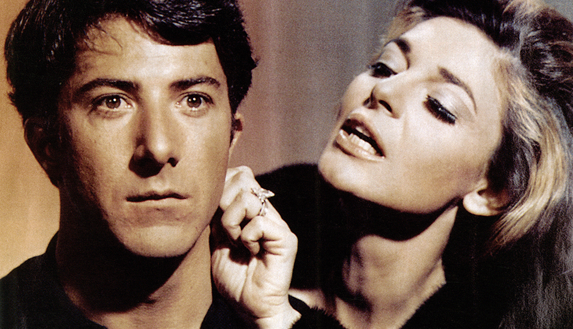 item 11 of Gallery image - anne bancroft touching dustin hoffman's ear in a still from the graduate