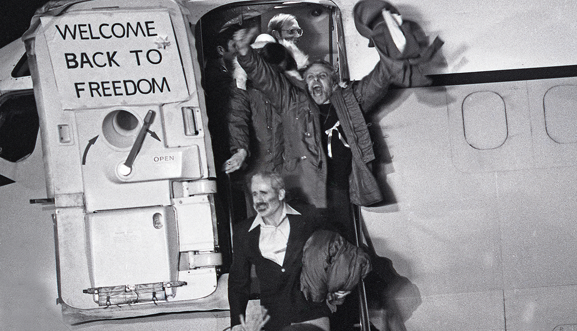 item 12 of Gallery image - hostages getting off plane after being released