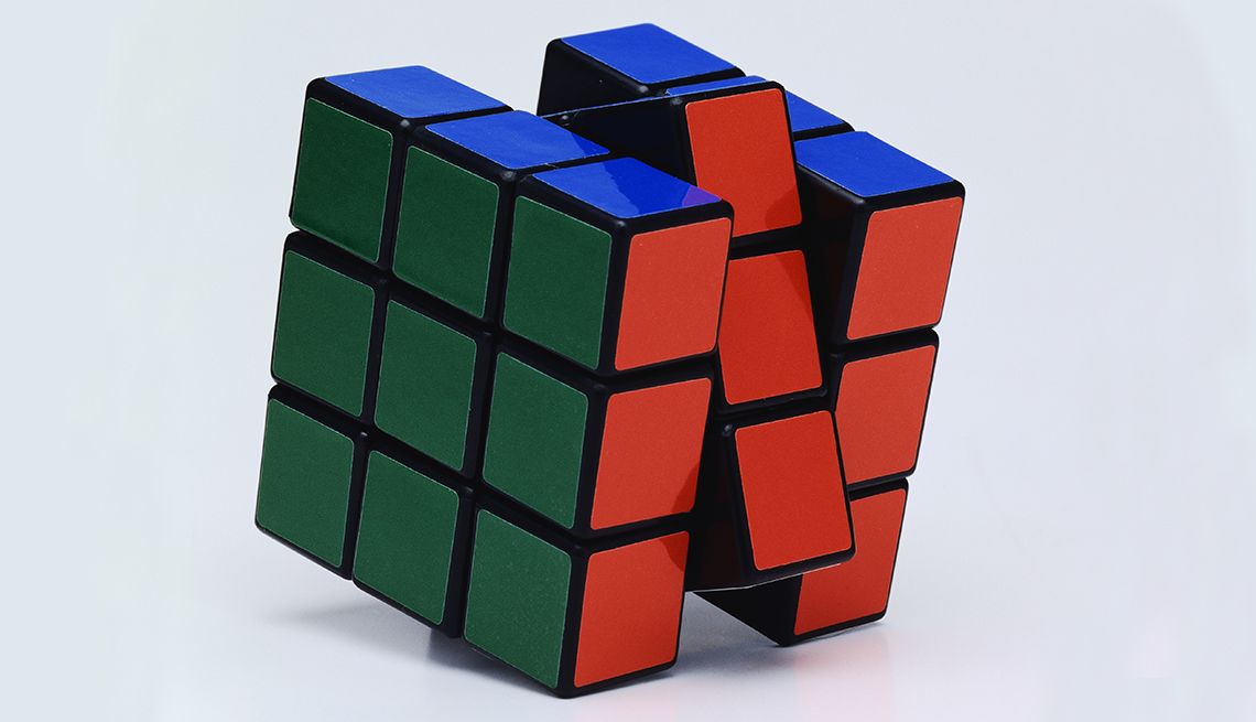 item 3 of Gallery image - green, blue and red rubik's cube with center column slightly turned