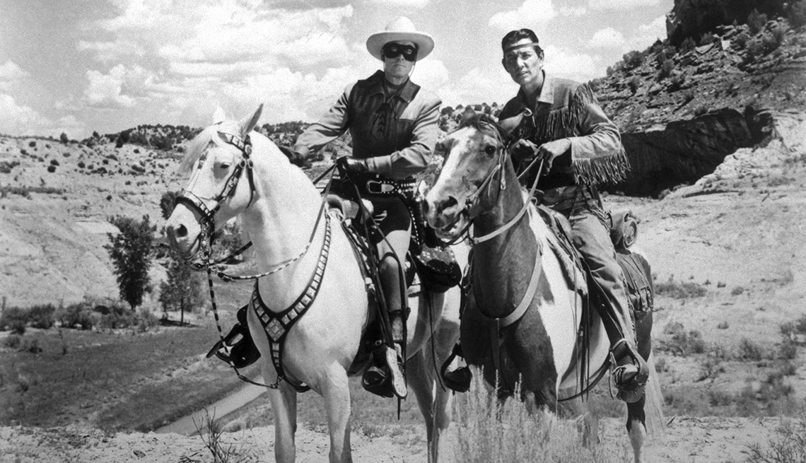 item 2 of Gallery image - two men riding horses in a still from the lone ranger
