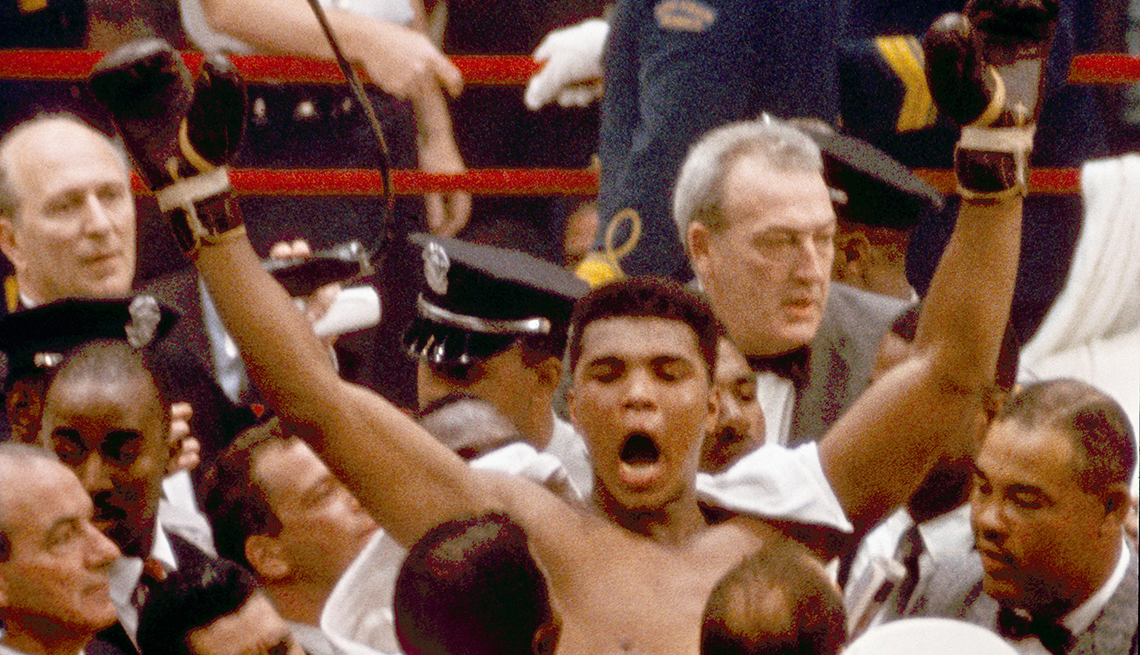 item 4 of Gallery image - muhammad ali shouting with arms raised surrounded by crowd of people