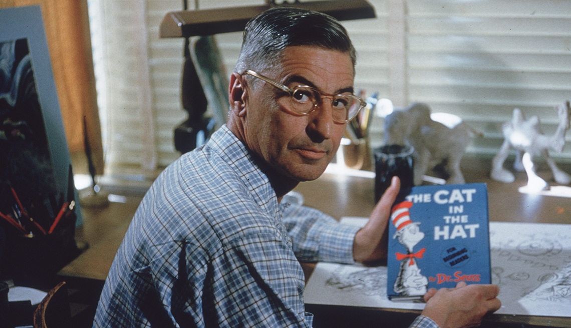 item 8 of Gallery image - doctor seuss holding the cat in the hat book while sitting at a desk