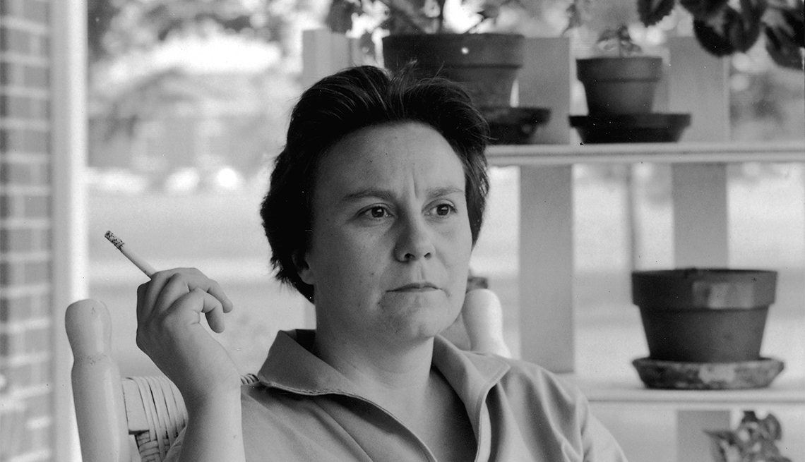 item 21 of Gallery image - Portrait of American novelist Harper Lee smoking a cigarette as she sits on the porch of her parents home, Monroeville, Alabama