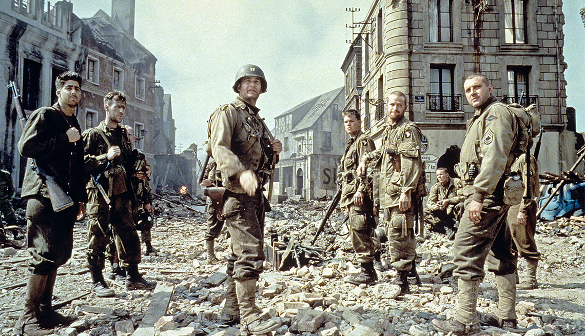 item 8 of Gallery image - Adam Goldberg, Demitri Goritsas, Tom Hanks, Matt Damon, Maximilian Martini and Tom Sizemore standing amongst rubble in a still from "Saving Private Ryan"