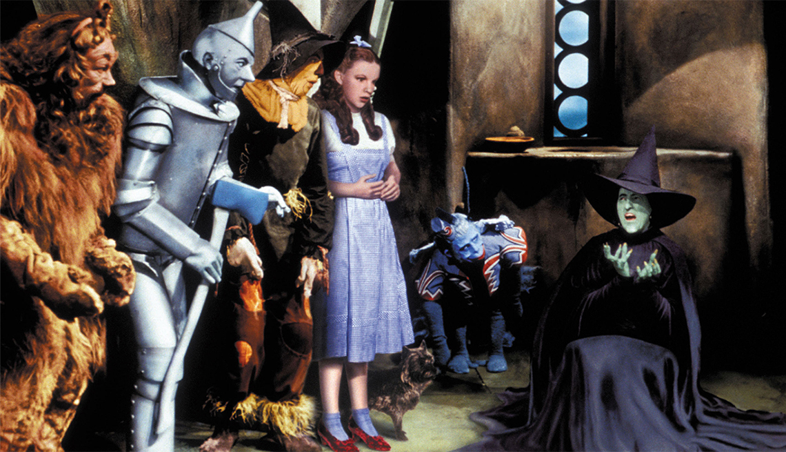 item 17 of Gallery image - Bert Lahr as the Cowardly Lion, Jack Haley as the Tin Man, Ray Bolger as the Scarecrow, Judy Garland as Dorothy Gale and Margaret Hamilton as the Wicked Witch of the West in a publicity still from the film, "The Wizard of Oz"