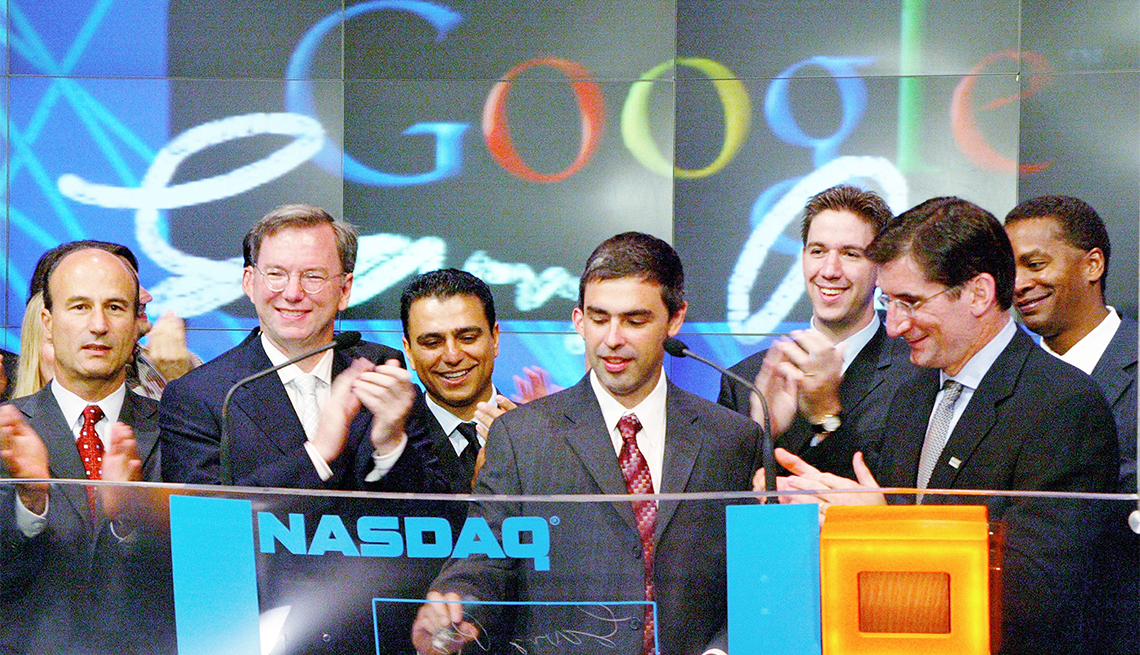 item 13 of Gallery image - Left to right: Google CFO George Reyes,  Chairman of the Executive Committee and CEO Eric E. Schmidt, SVP Worldwide Sales & Field Operations Omid Kordestani, Co-Founder and President of Products Larry Page, NASDAQ President and CEO Robert Greifeld and Google Vice President for Corporate Development David Drummond participate in a ceremony as Google, Inc. is listed on the NASDAQ stock exchange for the first time