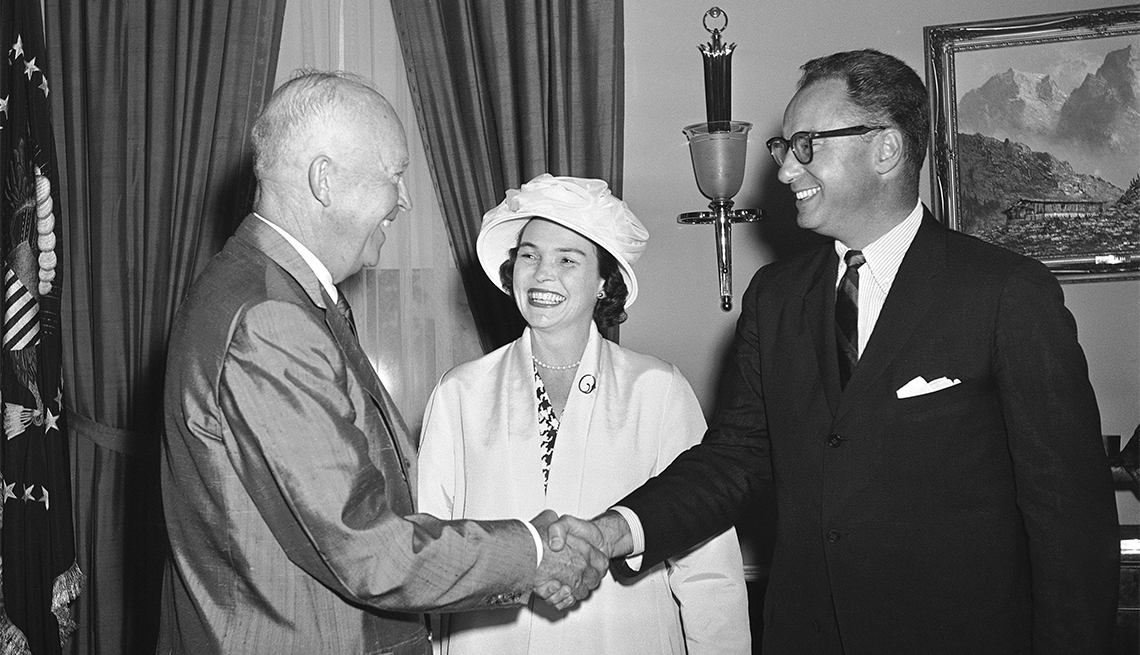 item 11 of Gallery image - President Dwight D. Eisenhower greets Gov. William Quinn of Hawaii with a handshake as he arrives at the White House. Gov. Quinn's wife Nancy is at center