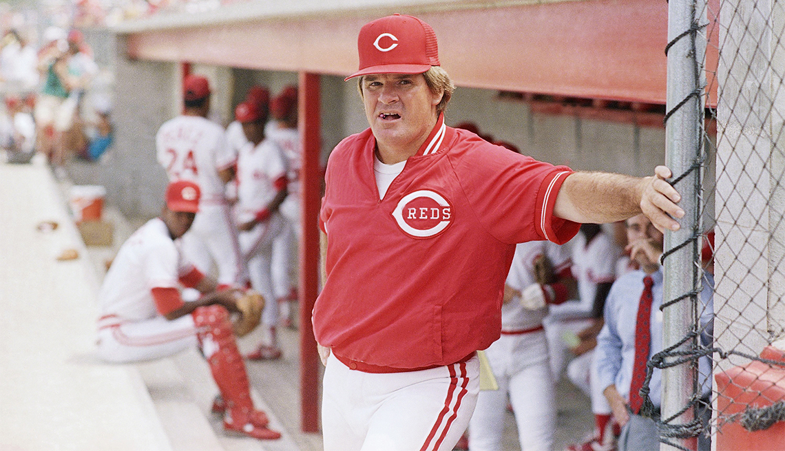 item 9 of Gallery image - Cincinnati Reds' manager Pete Rose Leans against the dugout before the start of game in Plant City, Florida