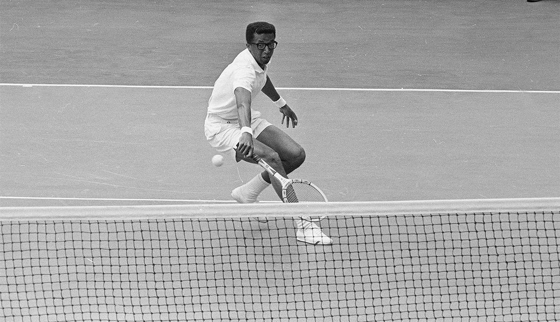 item 7 of Gallery image - Arthur Ashe backhands a return to Mexico's Rafael Osuna during the Davis Cup match