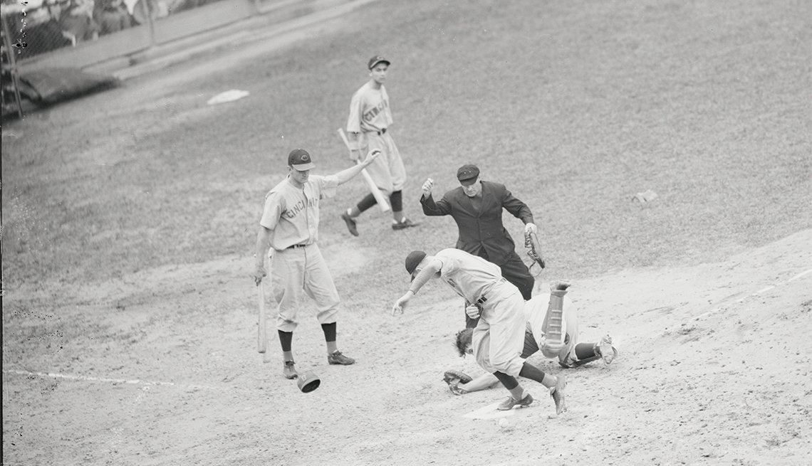 item 6 of Gallery image - Bucky Walters scoring, as Dodgers' catcher Babe Phelps rolls in the dirt after dropping the ball