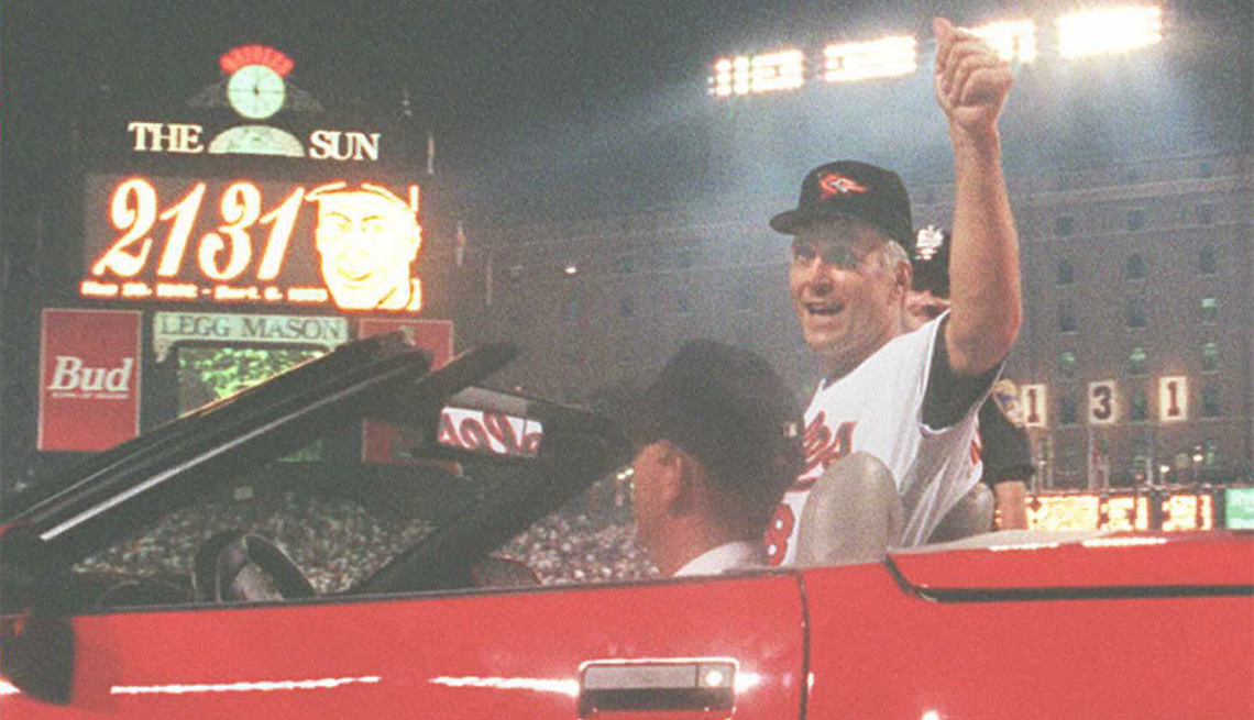 item 25 of Gallery image - Cal Ripken Jr. of the Baltimore Orioles waves to the crowd as he is driven around the field during a post-game ceremony where he was honored for setting a new record of 2,131 consecutive games played