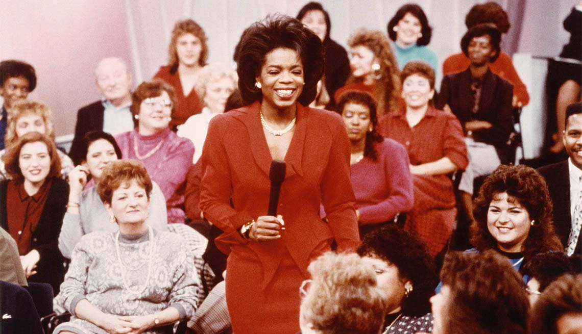 item 23 of Gallery image - Oprah standing with microphone, surrounded by crowd on The Oprah Winfrey show