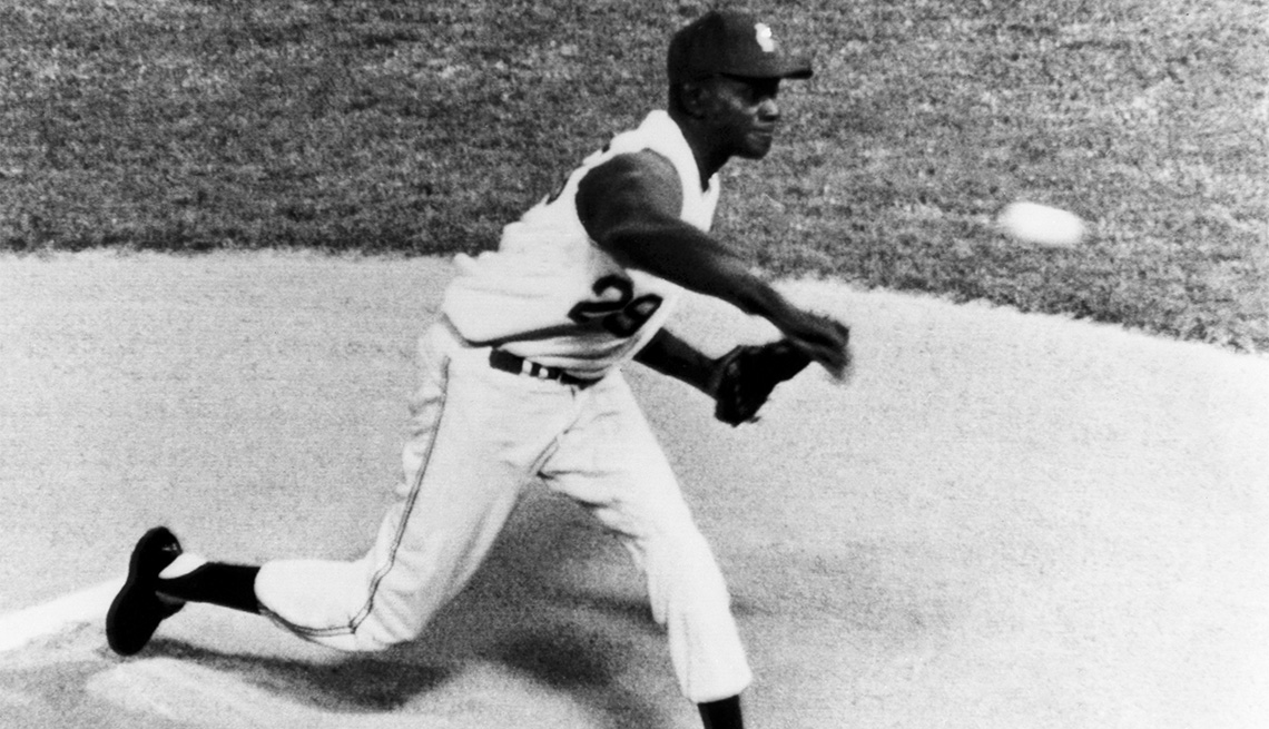 item 6 of Gallery image - Pitcher Satchel Paige of the Kansas City Athletics throws the pitch during an MLB game against the Boston Red Sox at Municipal Stadium in Kansas City, Missouri