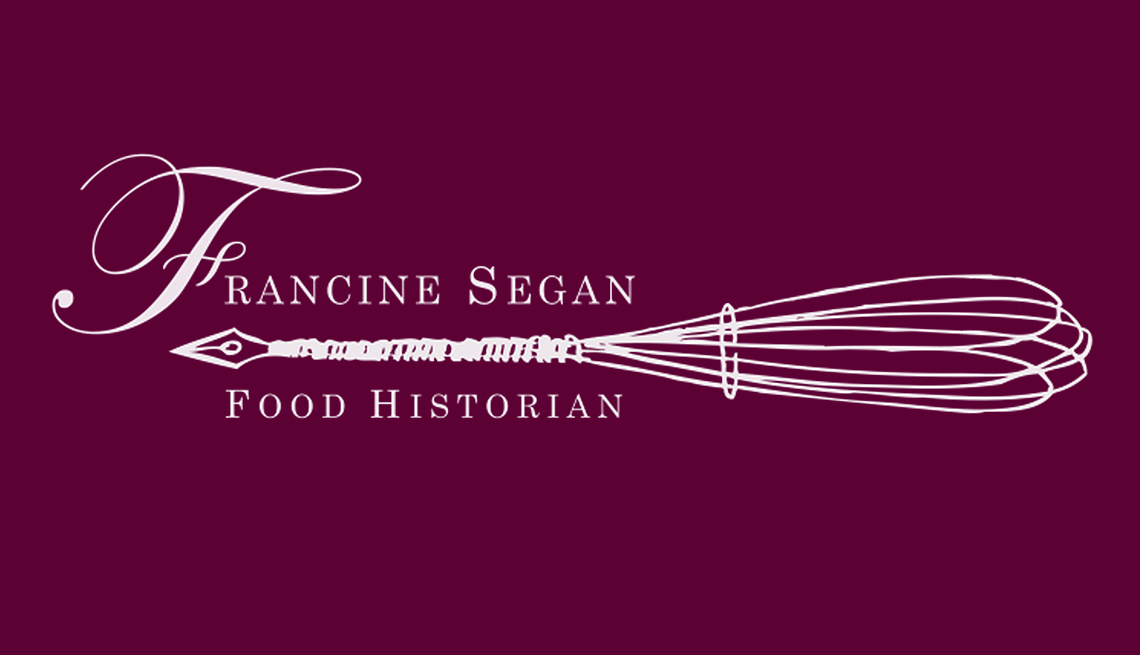 logo for Francine Segan Food Historian with a wire whisk whose handle looks like an old-fashioned pen