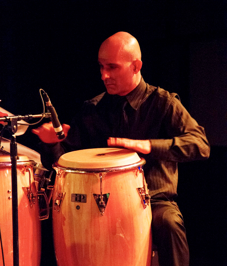 Shai Hayo of Salsa del Soul playing congas
