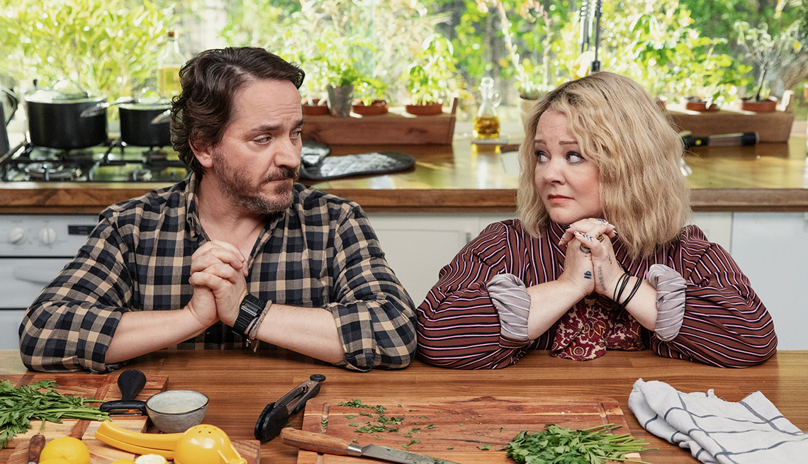 Ben Falcone and Melissa McCarthy perform in a kitchen on the Netflix show “God’s Favorite Idiot.”