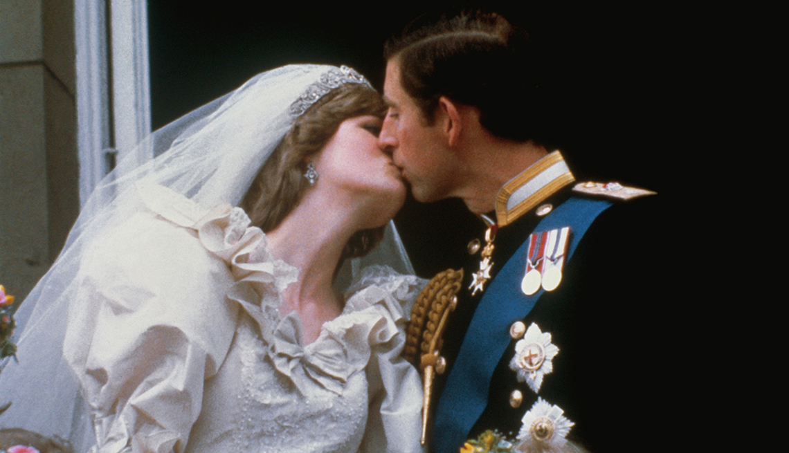 item 2 of Gallery image - Lady Diana Spencer kisses Prince Charles at their wedding