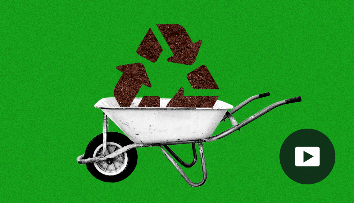 Photo illustration of a recycling symbol sitting in a wheel barrel on a green background. Video play button.
