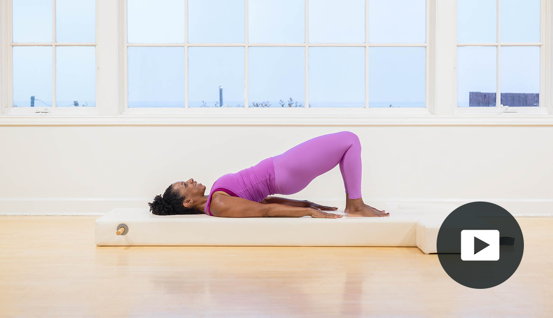 Kira Lamb performs Pilates to improve posture. Video play button.
