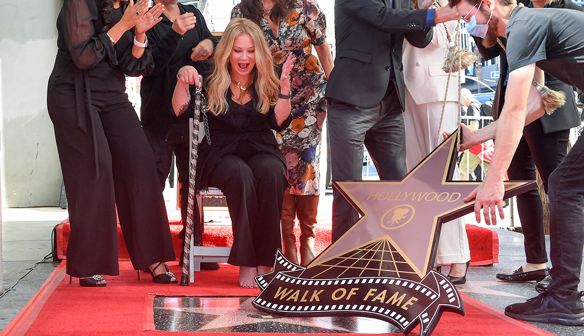 Actress Christina Applegate reacts in joy after her star at the Hollywood Walk of Fame is revealed
