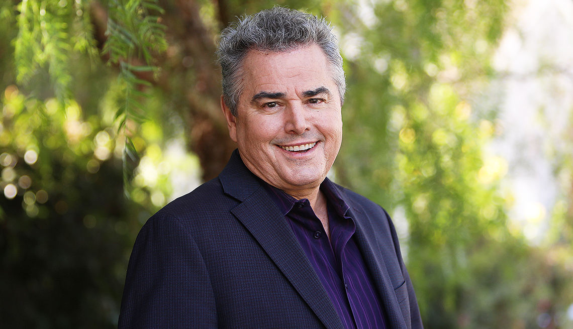 christopher knight in front of trees