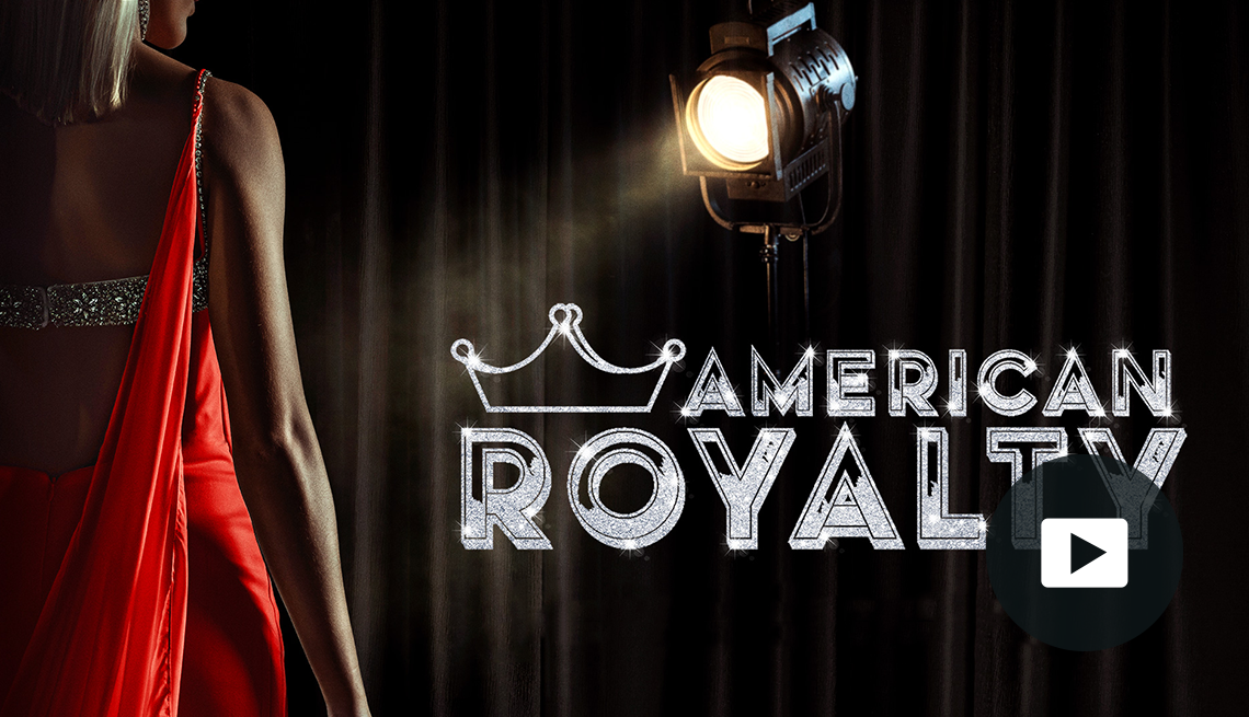 back of woman standing in red dress next to outline of a crown and the words american royalty; picture of play button on bottom right corner