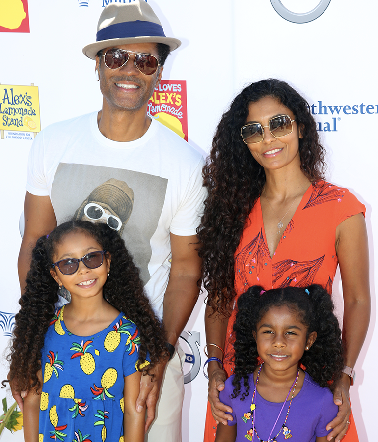 eric benet with manuela testolini and daughters lucia bella and amoura luna standing in front of alex's lemonade backdrop