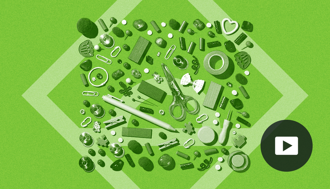 organizational supplies such as paper clips, rubber bands, scissors, screw driver, tape on green background with large diamond shape on it; picture of play button on bottom right corner