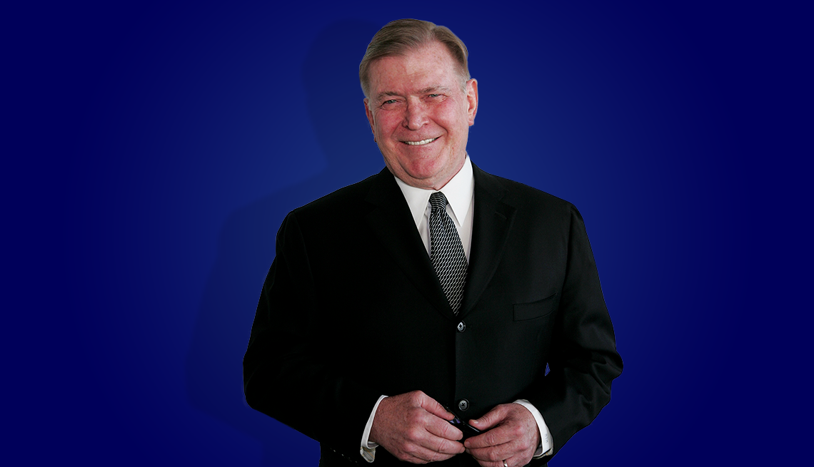 terry mcdonell in suit against dark blue background