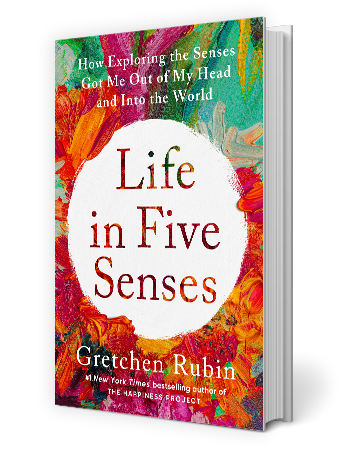 book cover that says life in five senses in white circle in center; how exploring the senses got me out of my head and into the world is written on top; gretchen rubin written on bottom; flowers surround words