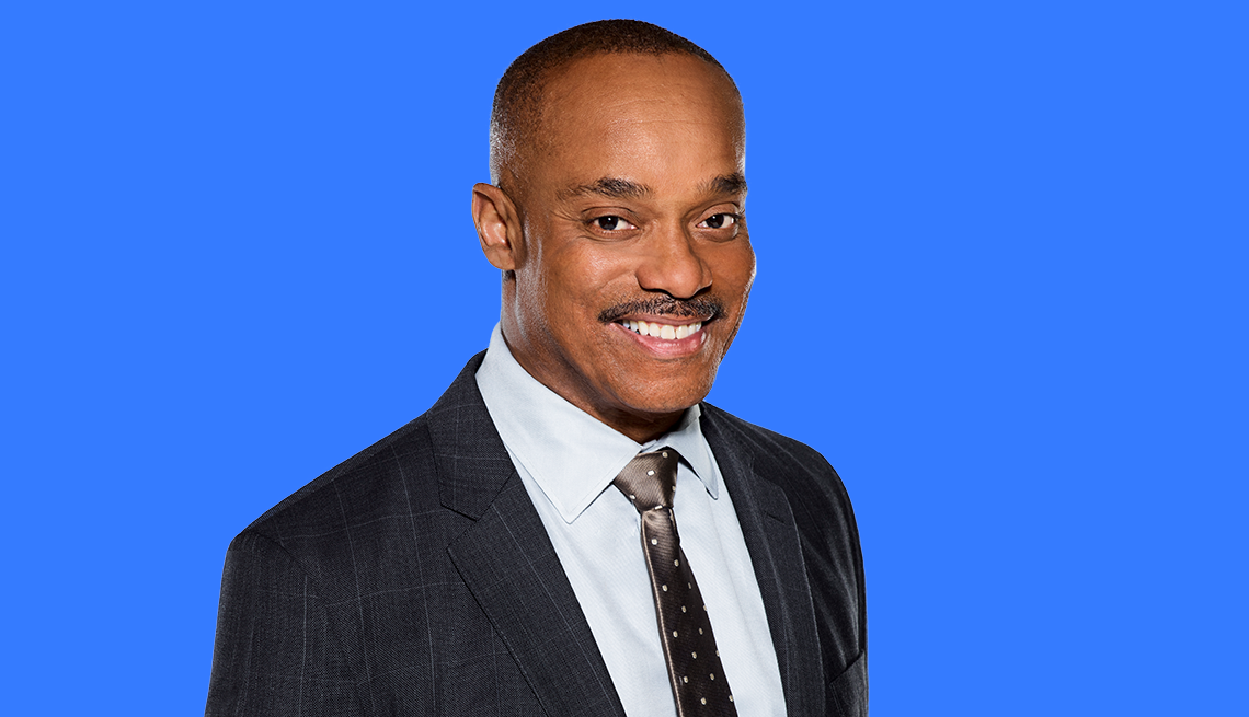 rocky carroll against blue background