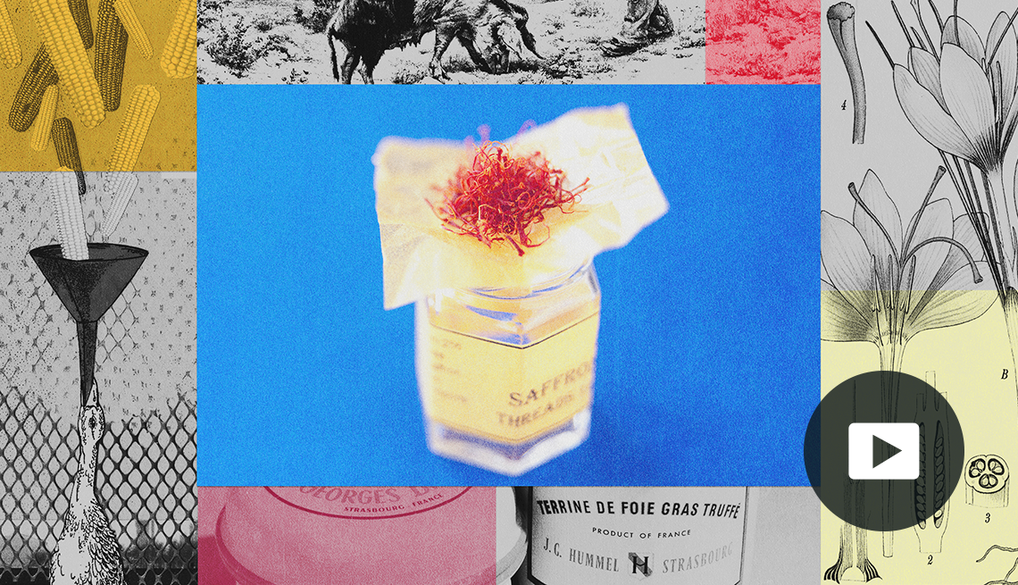 Saffron jar with saffron sticking out of top in center on blue background; collage of all sorts of foods surrounding it