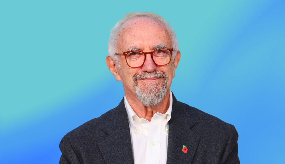 Jonathan Pryce on blue ombre background