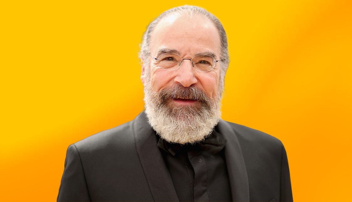 Mandy Patinkin against yellow ombre background