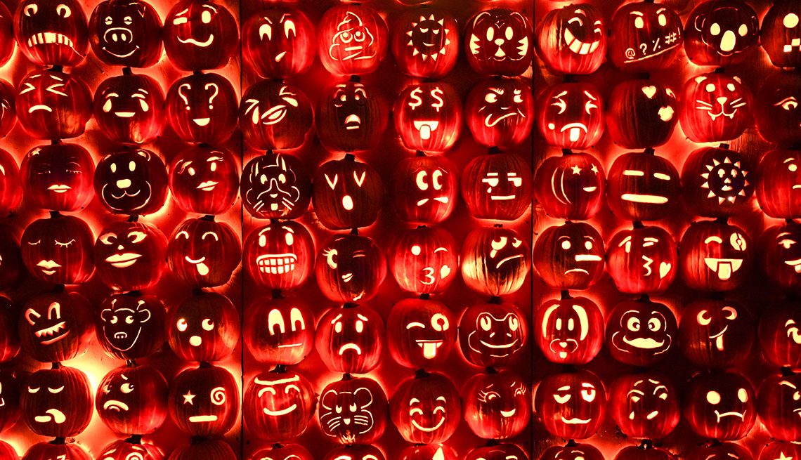 glowing pumpkins with all different carvings