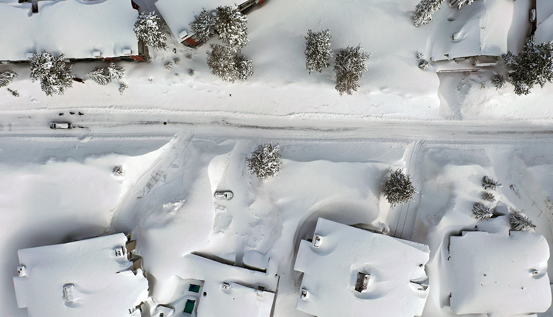 item 6 of Gallery image - aerial view of snow-covered houses, street and trees